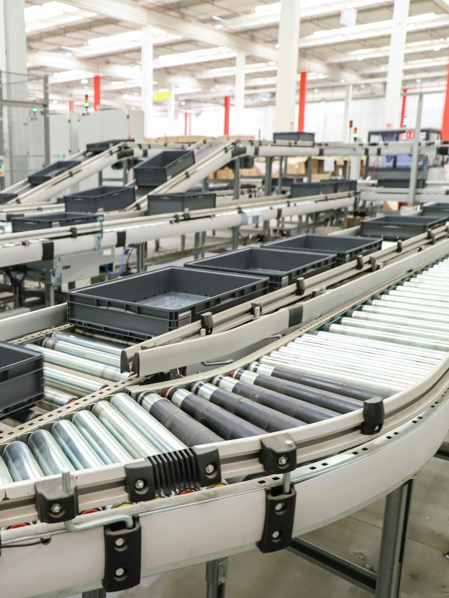 packing line in a logistics warehouse - conveyor belts inside a logistics warehouse